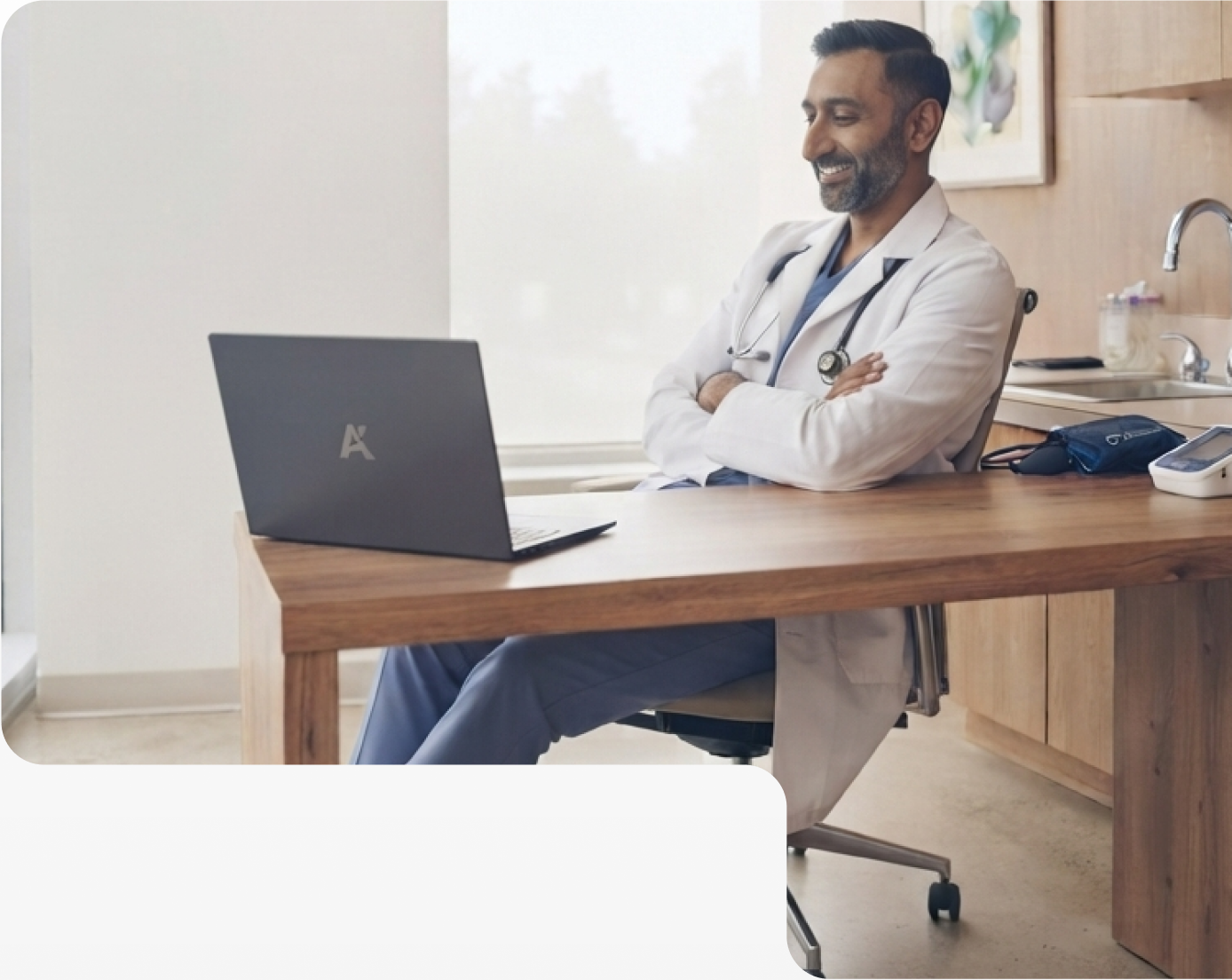 Physician reviewing clean claims on a laptop